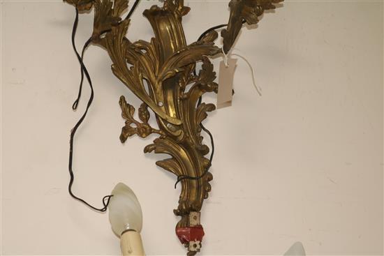 A pair of three branch ormolu wall lights length 55cm